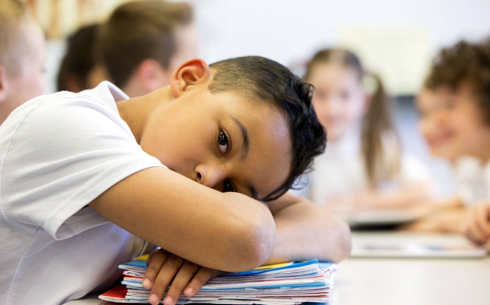 Poor acoustics in UK classrooms;  causes, impact and solutions